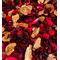 A close up view of the Apple Cinnamon Potpourri by Irish Twins Potpourri showing the types of dried botanicals. The color is mostly red.